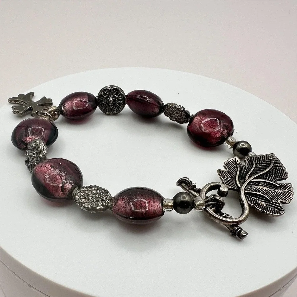 Vintage 90s Silver Tone Leaf Cross Charm Purple Foil Glass Bead Toggle Bracelet